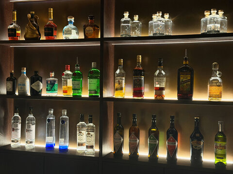 Hamburg, Germany - November 23, 2025: various bottles of alcohol on a shelf