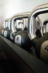 Dumbbells weight lifting in fitness studio on a white background.