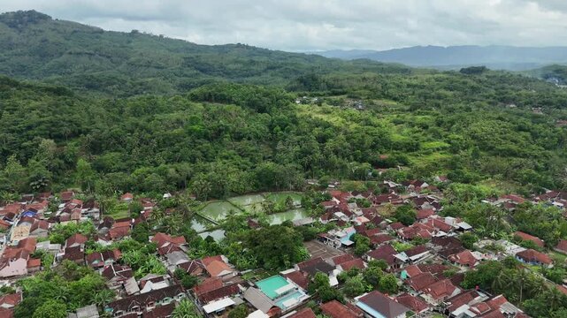 Drone footage of residential areas with a hilly background in Banjar City, West Java, Indonesia