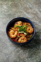 A delicious blend of shrimp, colorful peppers, and tender noodles brings a burst of flavor to the table. This dish showcases vibrant colors and inviting aromas, perfect for any time
