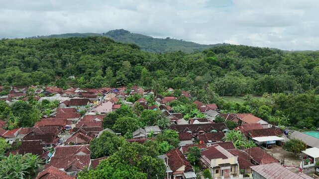 Drone footage of residential areas with a hilly background in Banjar City, West Java, Indonesia