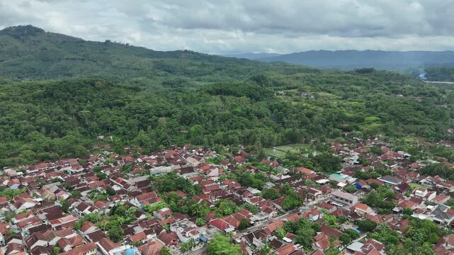 Drone footage of residential areas with a hilly background in Banjar City, West Java, Indonesia