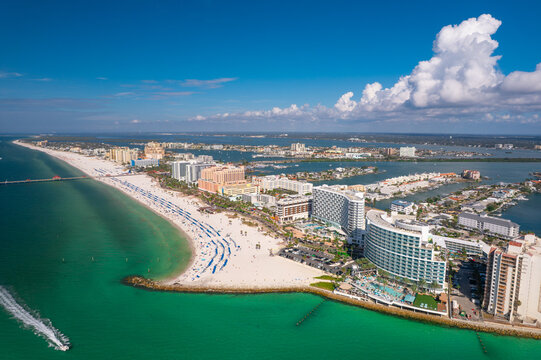 Panorama of city Clearwater Beach FL. Spring, winter or summer vacations in Florida. Beautiful View on Hotels and Resorts on Island. Blue-Turquoise of Ocean water. Gulf of Mexico or America. Sunny day
