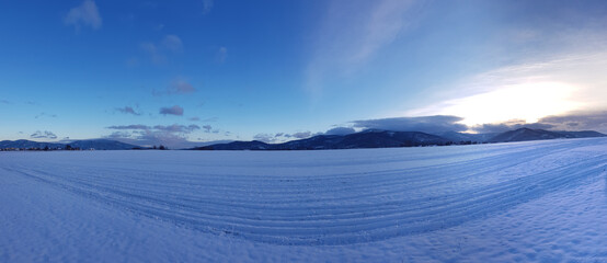 Winter sunset landscape snowy mountain scenery postcard background.