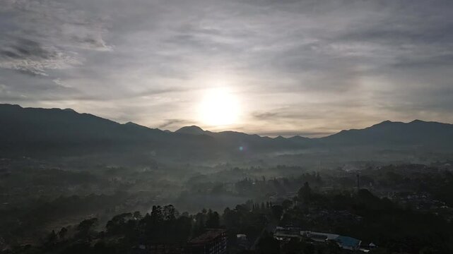 Drone footage of sunrise in the hills of Cisarua, West Java, Indonesia