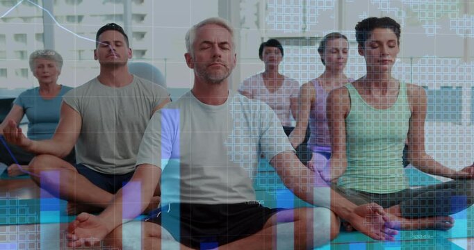 Center man leading cue while class moving hands and overlay showing bar charts for yoga metrics