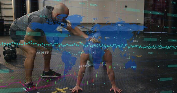 Woman doing pushups in gym on coach tap while coach correcting form, map overlay superimposing data