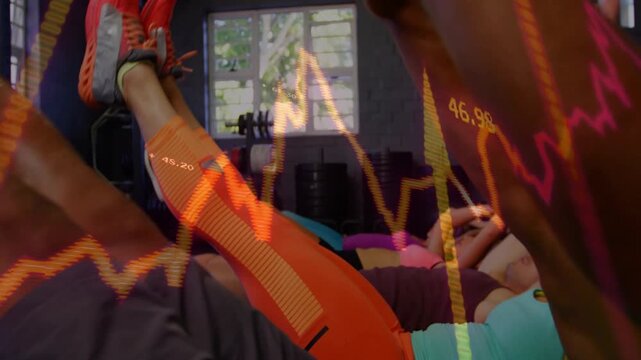 Group doing synced V-up reps on cue for core training, overlay heart-rate graphs linked to trackers