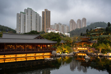 Diamond Hill, Kowloon, Hong Kong : traditional pavilions and wooden gallery reflected on the pond...