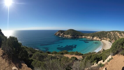 Obraz premium Coastal landscape view of a bay from cliffs with sky and ocean, featuring sandy beach, rocky shoreline, and lush greenery.