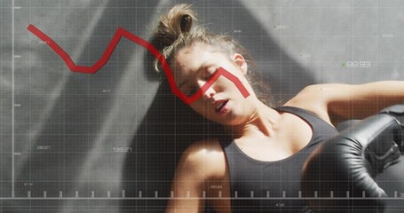 Boxer lying on dark mat, raising glove as glove sliding from right, red chart tracking recovery - Powered by Adobe