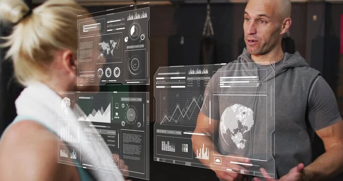 Gym coach talking causing floating panels showing charts dials as client listening checking metrics