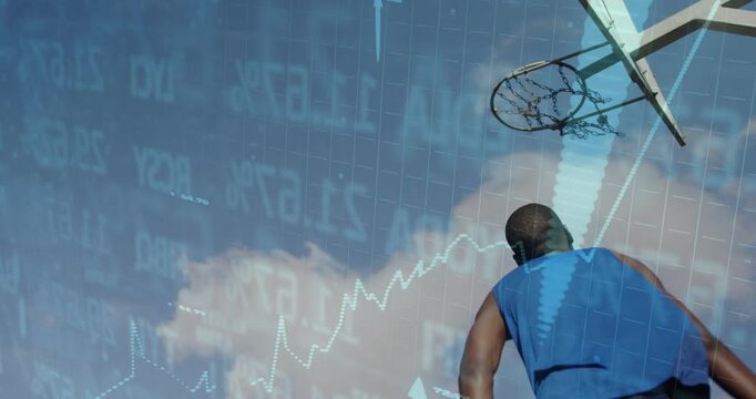 Male basketball player launching toward rim, dunking as financial charts overlaying, showing growth