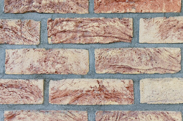 Fototapeta premium Red brick wall background stretcher bond, simplest repeating pattern of brickwork, rows of red bricks