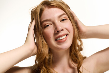 Fototapeta premium Young woman with natural beauty showcases her radiance in a bright studio setting