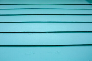 easter egg blue teal lapboard siding on house