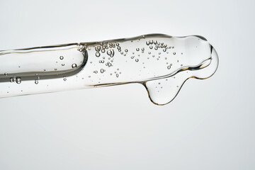 Serum cosmetic pipette dropper with liquid and bubbles