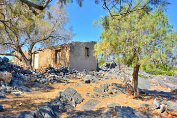 Ruined old house near Elounda town on the island of Crete in Greece