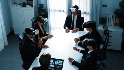 Top view of project manager working on laptop and sending data analysis to business people by using VR glass headset. Professional marketing team enter metadata or virtual world program. Directorate.