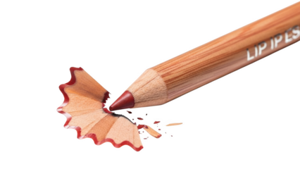 Red lip pencil sharpening with wood shavings on black background makeup cosmetic