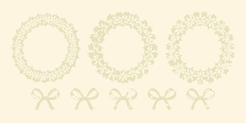 Delicate floral wreaths and ribbon bows in a muted green palette