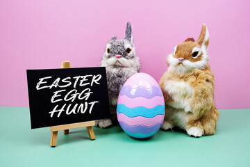 Easter Egg Hunt text with rabbit and egg on pink and green background