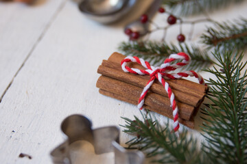 Christmas cinnamon sticks with pine sprigs