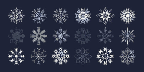 An assortment of delicate detailed snowflake illustrations on a dark background