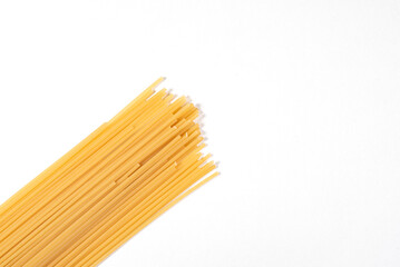 A long row of pasta is shown on a white background
