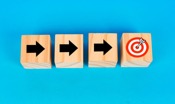 A goal achievement concept illustrated with directional arrows leading toward a target symbolizing results and success.
