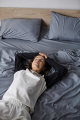 Fototapeta premium Finding solace in bed while embracing a day of rest and self-care