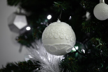 White Christmas tree ornament with glitter and lace detail