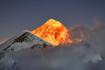 Summit of Mount Everest with last rays of sun at sunset