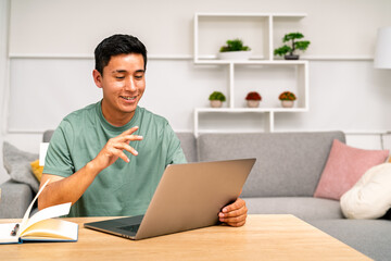 Young man having video call working from home