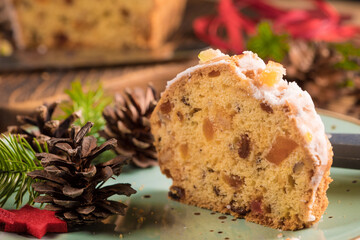 Traditional Christmas cake with candied fruit, raisins and fruits. Shallow depth of field.
