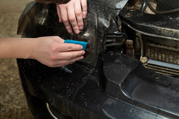 Tinting of the rear headlights of the car.Car design.Detaling center.
