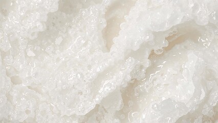 Obraz premium Close-up of a white crystalline substance with a textured surface.