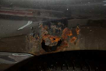 Rust on the body of an old car.