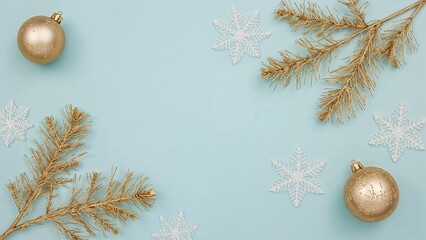 Gold Christmas ornaments, pine branches, and snowflake decorations on a light blue background, festive holiday decoration, winter seasonal celebration.