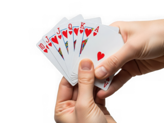 Close up of a hand holding a fan of red heart playing cards against a for gambling and casino concepts