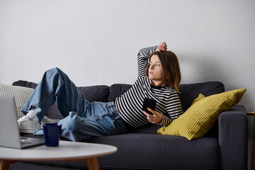 Relaxing day for a young woman embracing self-care in her cozy apartment