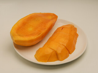 Peeled mango on white background