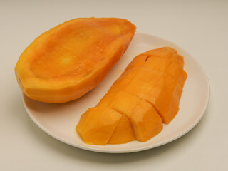 Peeled mango on white background