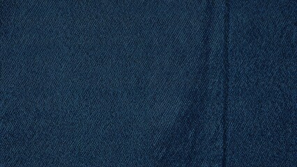 A close-up of denim fabric texture with a dark blue color.