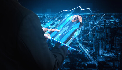 A business professional uses a tablet to engage with innovative data displays, highlighting financial trends and insights against a dazzling urban skyline at night. Scalp