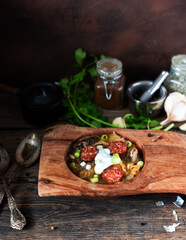 Christmas cabbage soup kapustnica with mushrooms on natural background.