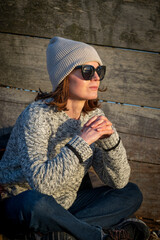 woman sitting in the winter sun outdoors