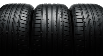 Three identical, matte black, high-performance tires aligned precisely. Sharp focus on the aggressive asymmetric tread pattern, dramatically rim-lit on a transparent studio background. Concept for