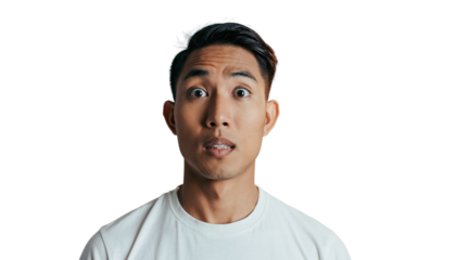 Close-up portrait of a young man with a wide-eyed, shocked and surprised expression.