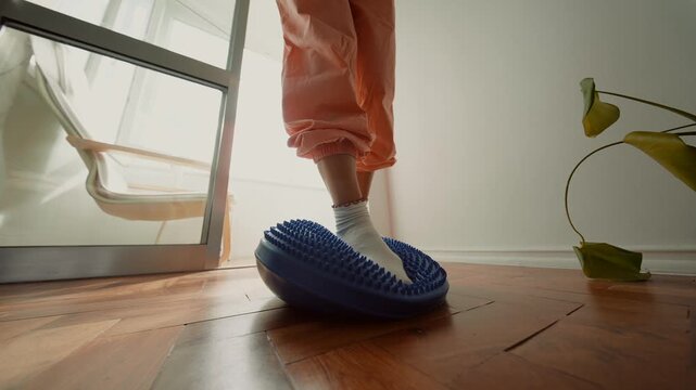 Child engages in therapeutic activity focusing on posture and coordination